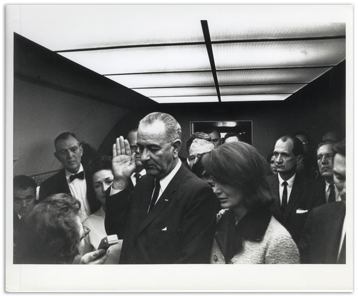 Cecil W. Stoughton's Personal, Unpublished 10'' x 8'' Photo of LBJ's Inauguration Aboard Air Force One -- LBJ Takes the Oath of Office as a Stunned Jackie Watches